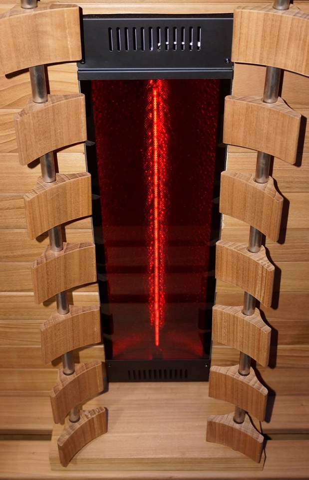 A vertical infrared heater with a glowing red heating element, surrounded by curved wooden slats and mounted in a wooden enclosure.