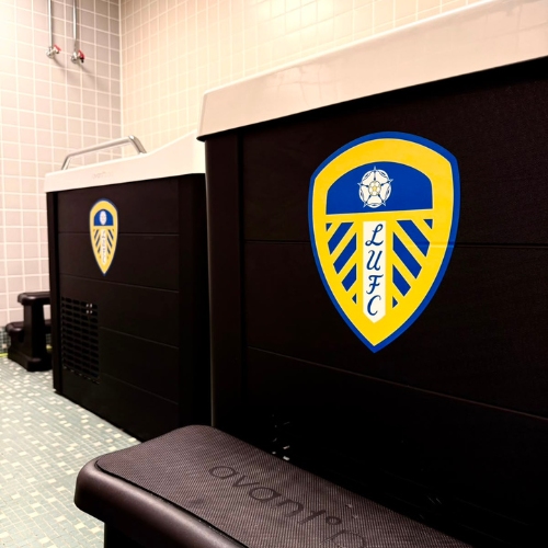 Two black C11 ice baths branded with Leeds United FC logos in a tiled changing room at Croke Park.