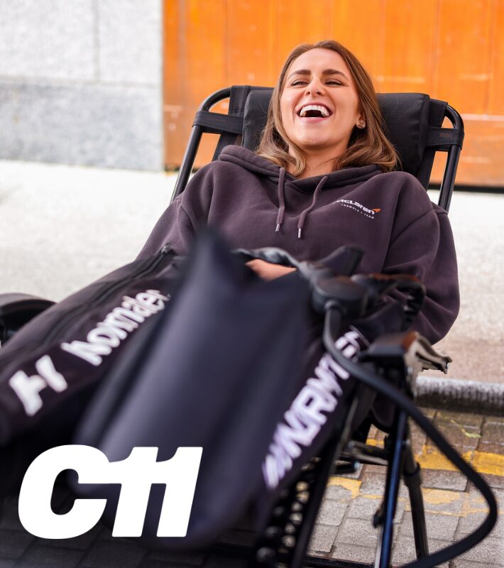 Athlete relaxing in C11 compression boots